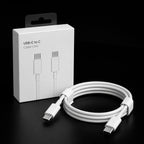 White USB-C to C cable with a coiled loop and white plastic ties, displayed next to its white retail packaging box on a black background.