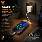 A white WOOS brand 25W USB-C power adapter plugged into a wall socket, charging a smartphone on a wooden desk next to a laptop. The image features promotional text and icons highlighting its features like 25W super fast charging, USB-C power delivery, multi-protection, and compact lightweight design.